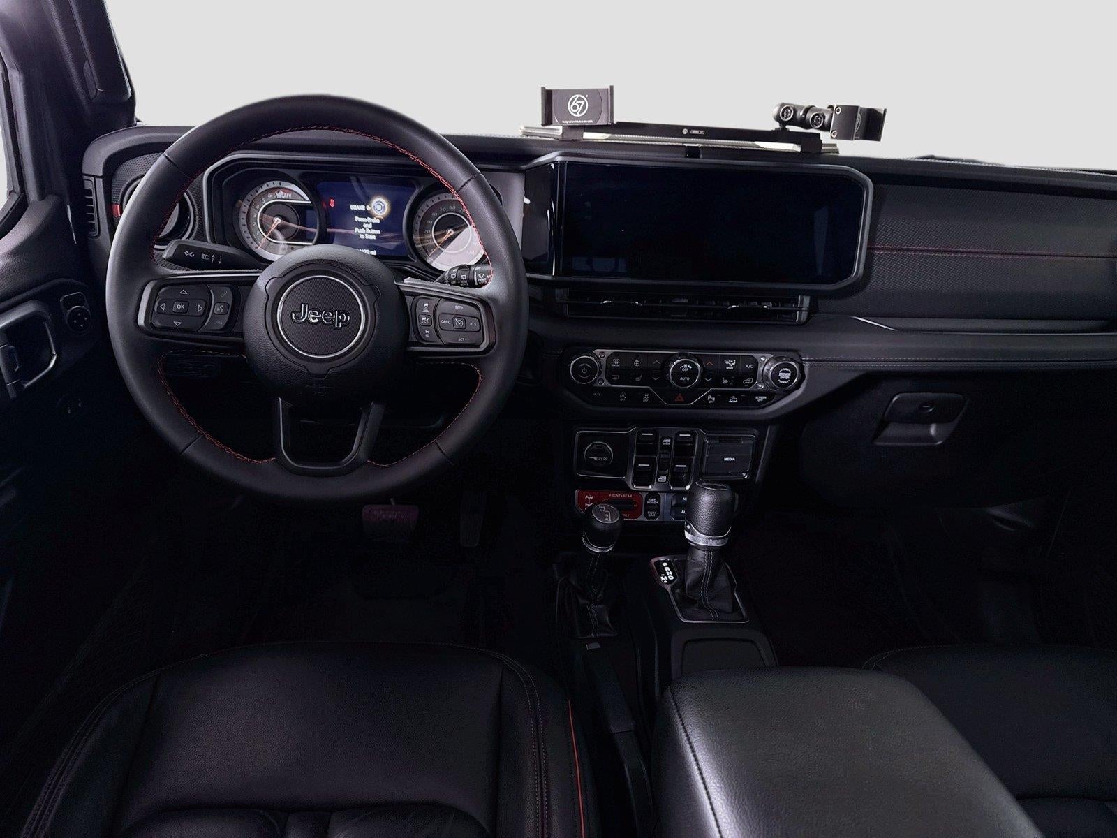 Used 2024 Jeep Wrangler 4-Door Rubicon with VIN 1C4PJXFG2RW283908 for sale in Faribault, Minnesota